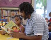 Dad reading to girl