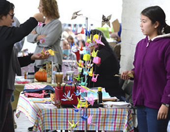 Girl selling crafts at the annual All-Kids Craft Fair