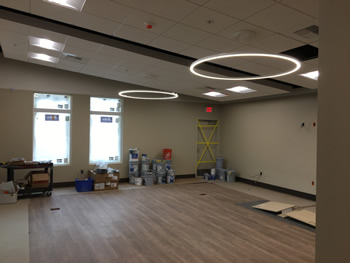 The interior of the Community Room of new Empire Library. Includes flooring, overhead lights, and windows.