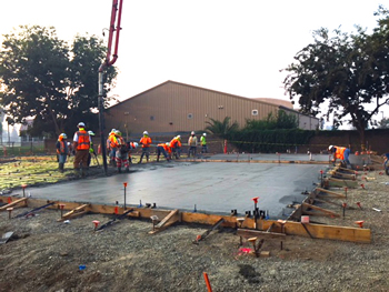 The concrete for the foundation slab for the new Empire Library being poured.