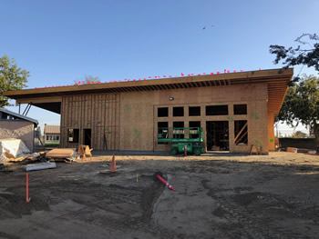 The unfinished wood exterior of the front and one side wall for the new Empire Library.