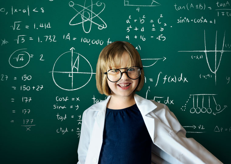 Teen in front of chalkboard