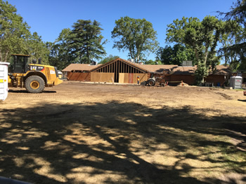 Grading the area where construction for the addition to the library will be done.