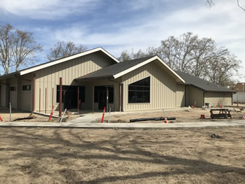 The exterior of the library with a coat of tan paint on the walls.