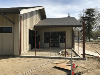 The exterior of the library with a coat of tan paint on the walls.