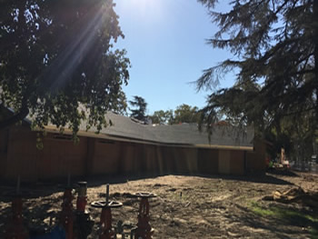 The exterior of the library with the plywood walls.