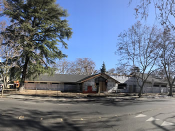 The exterior of the library with the plywood walls.